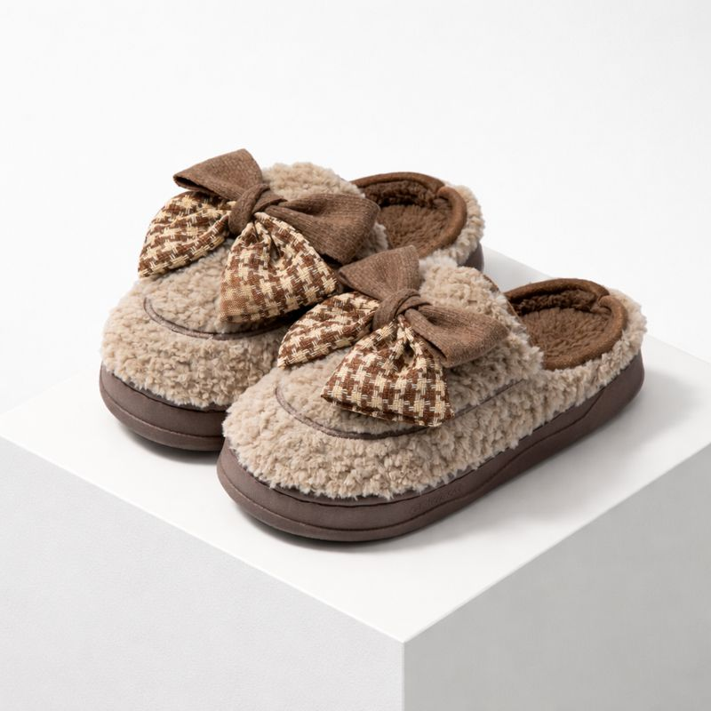 Soft teddy slippers with an oversized bow detail and non-slip sole in brown and white