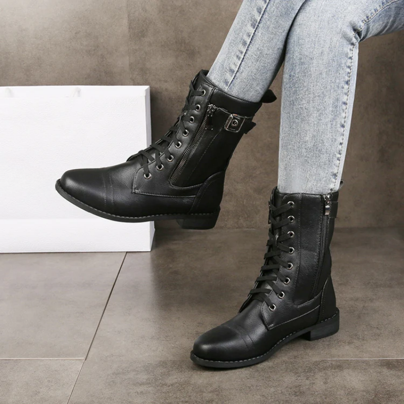 Eco-leather lace-up boots with buckle detail, side zip and a low heel