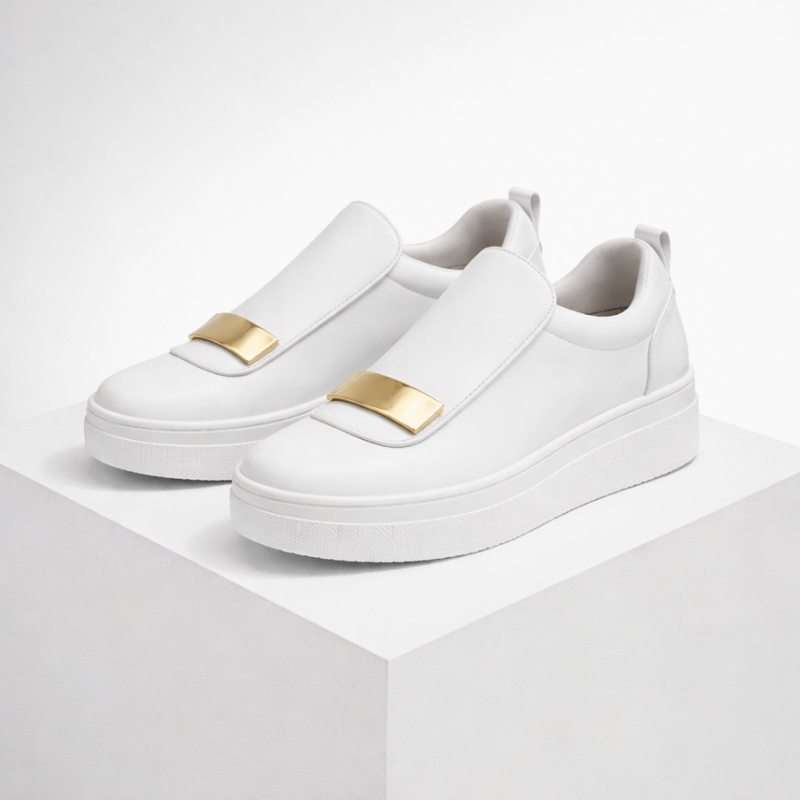 Cushioned platform slip-on shoes shown in green, white and black