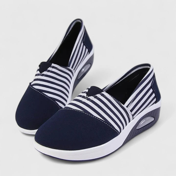 Comfortable everyday women's slip-on sneakers shown in blue, black and red