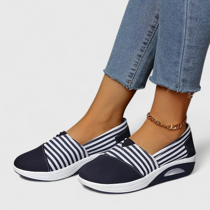 Comfortable everyday women's slip-on sneakers shown in blue, black and red