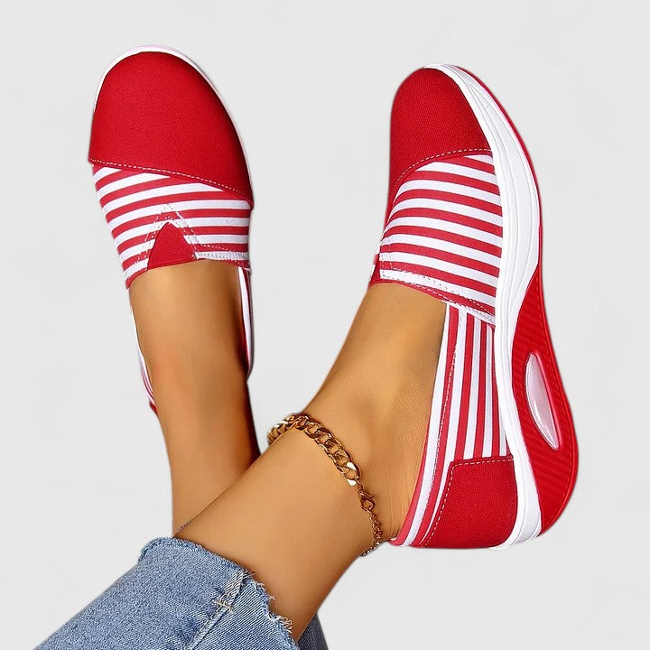 Comfortable everyday women's slip-on sneakers shown in blue, black and red