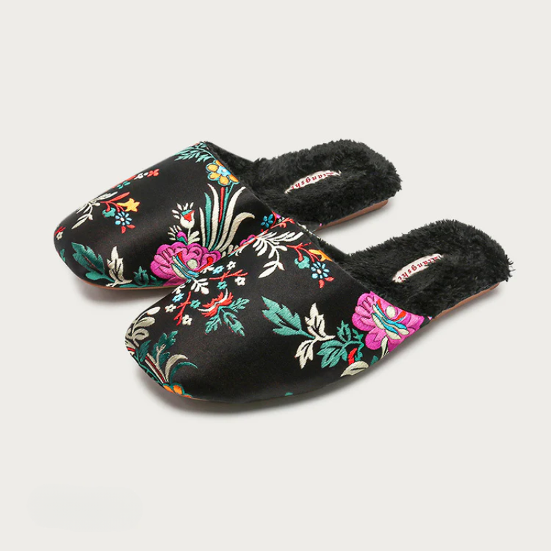 Satin floral slippers with embroidered detailing and soft plush lining, shown in green, pink and black