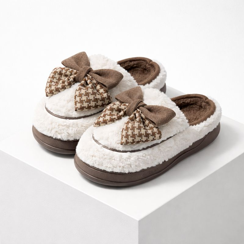Soft teddy slippers with an oversized bow detail and non-slip sole in brown and white