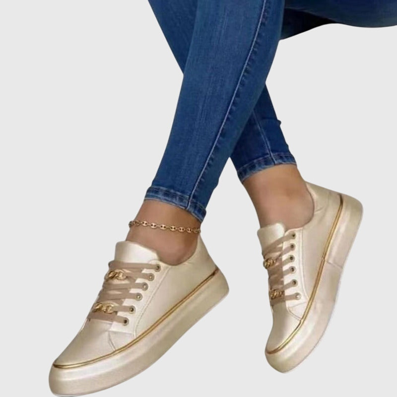 Camille slip-on everyday sneakers shown in black, white and gold