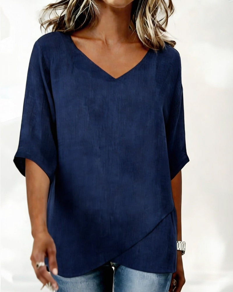 Donna irregular V-neck top shown in blue, white and navy blue