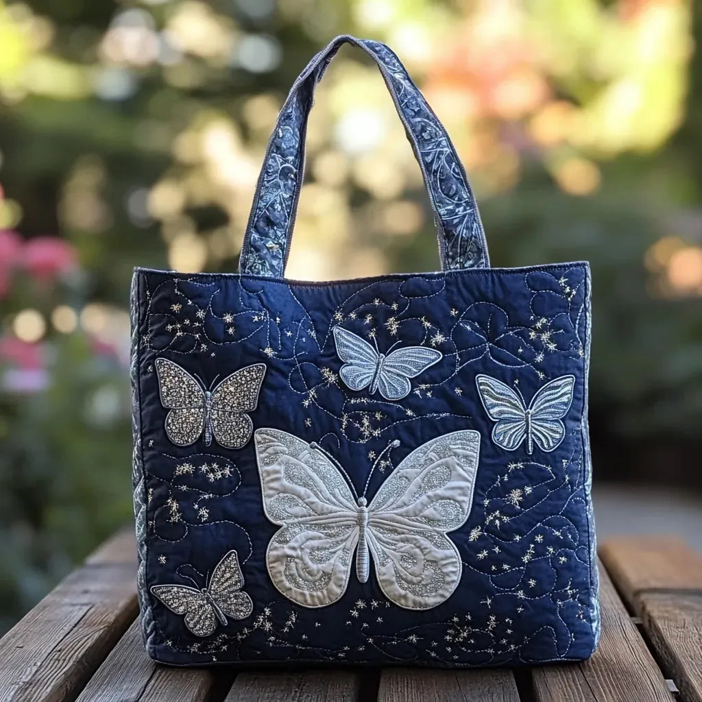 Handmade silver artisan bag with butterfly detail, shown in two sizes