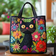 Quilted handmade bag featuring a whimsical enchanted black cat design
