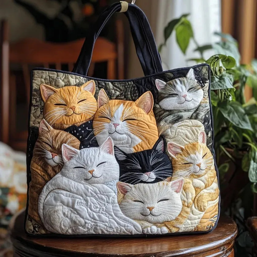 Handmade quilted artisan tote bag featuring a cute sleeping kittens print