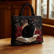 Artisan quilted tote bag with a black cat on books design, shown in two sizes