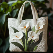 White Lilies quilted artisan handmade bag with textured stitching, shown in two sizes
