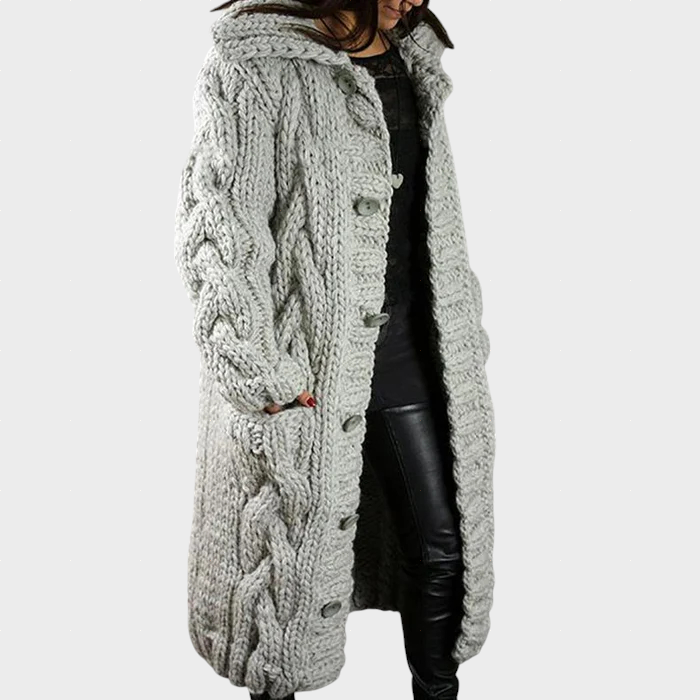 Karina oversized cable knit longline hooded coat shown in a soft neutral shade