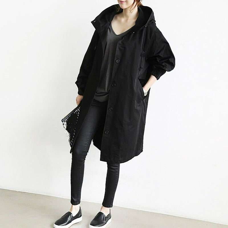Eva tailored trench coat shown in neutral and soft colours, buttoned and belted