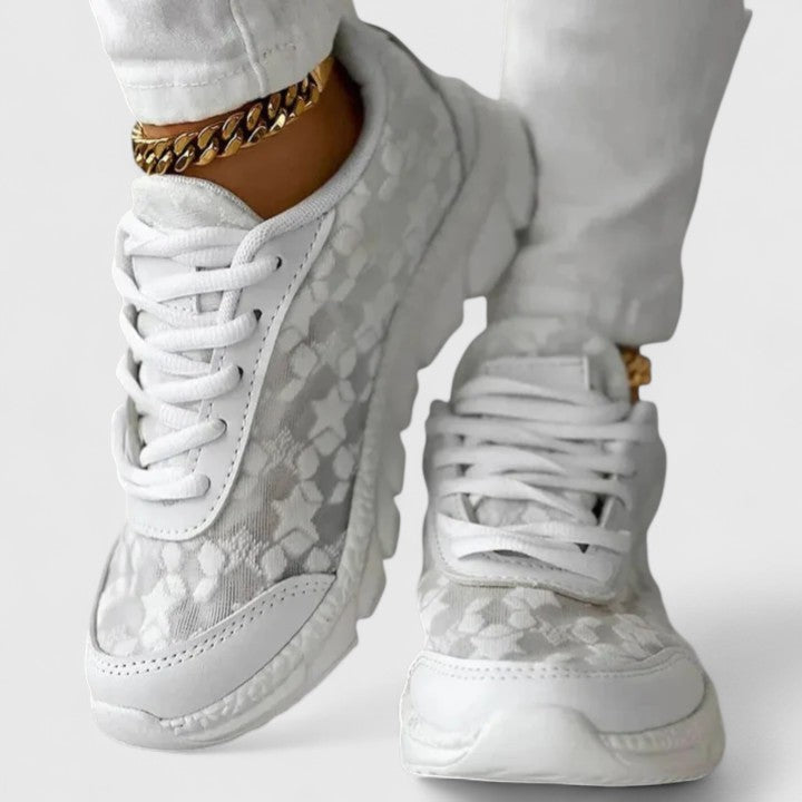 White cushioned lace-up sneakers with a grippy sole for everyday wear
