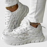 White cushioned lace-up sneakers with a grippy sole for everyday wear