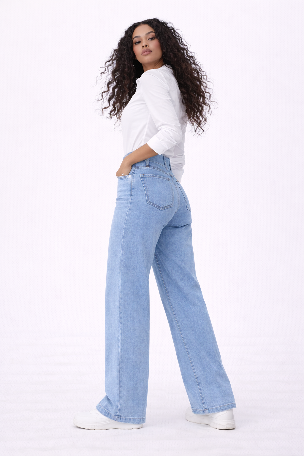 Amara blue elastic high-waist flare jeans shown on a model