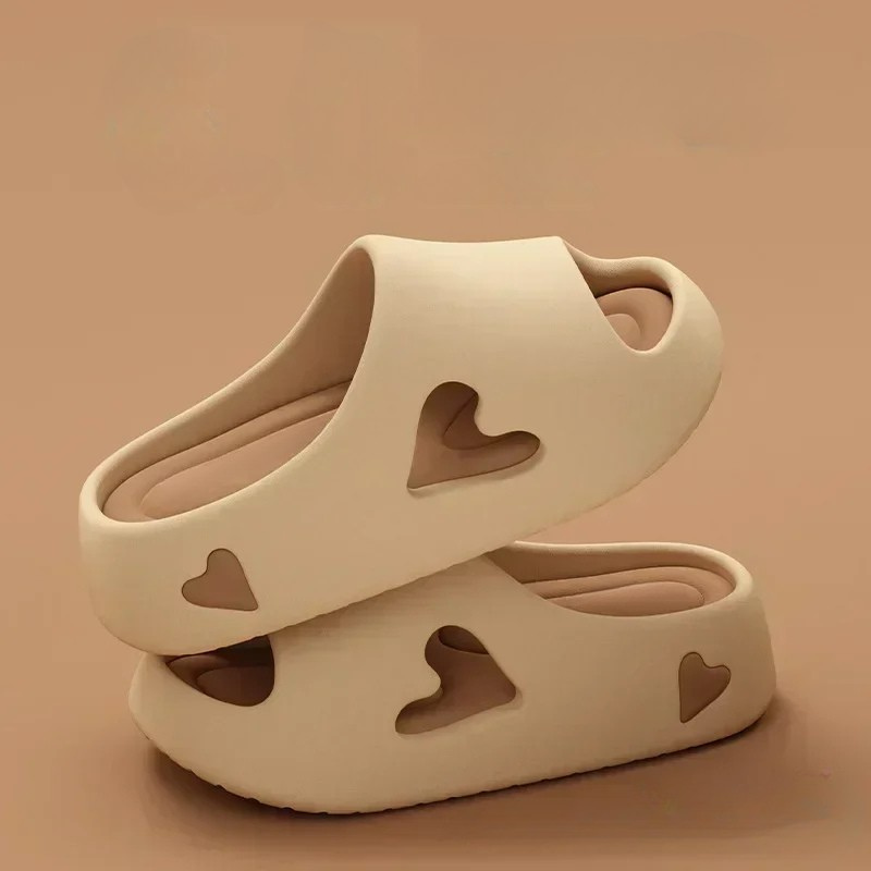 Heart-detail cushioned platform slides shown in purple, khaki, black and white