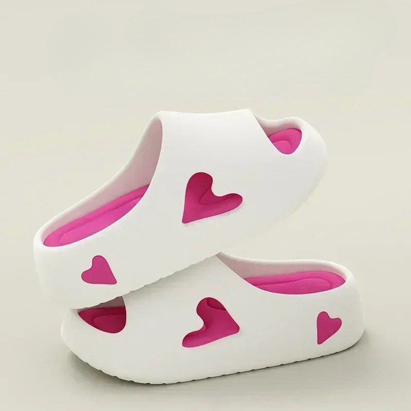 Heart-detail cushioned platform slides shown in purple, khaki, black and white