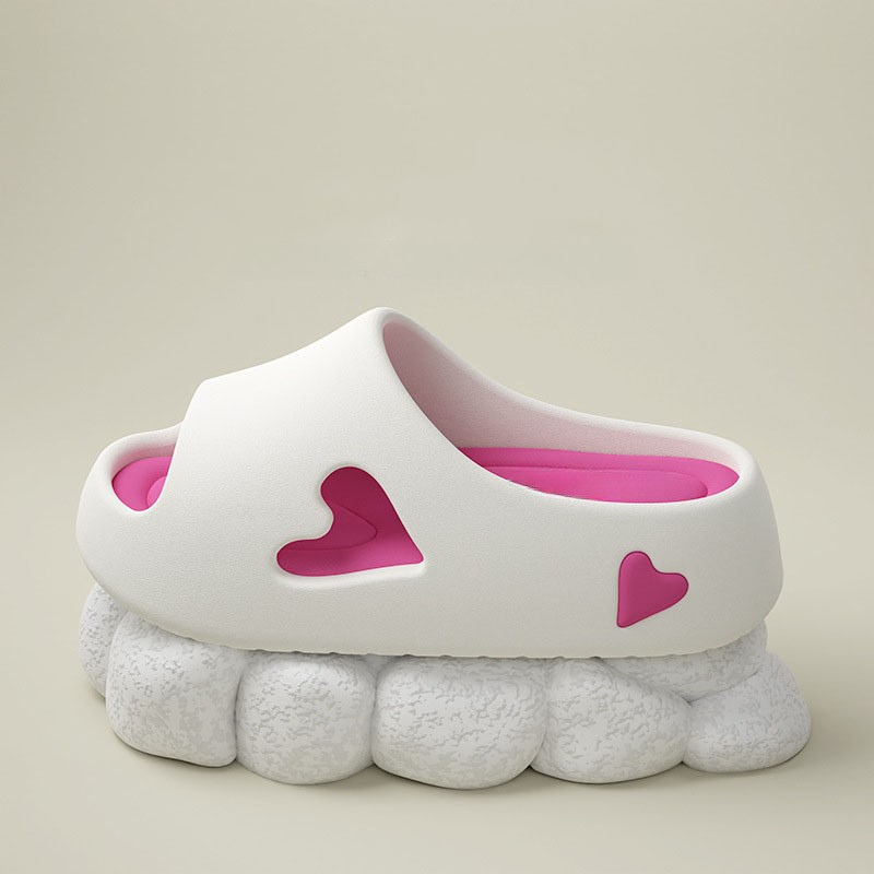 Heart-detail cushioned platform slides shown in purple, khaki, black and white