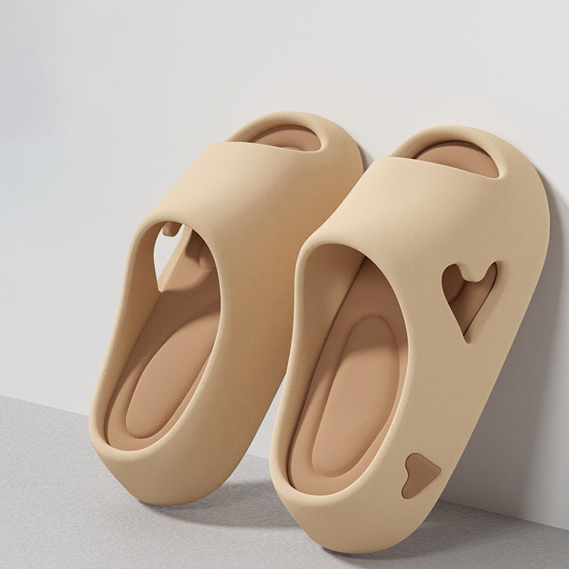 Heart-detail cushioned platform slides shown in purple, khaki, black and white