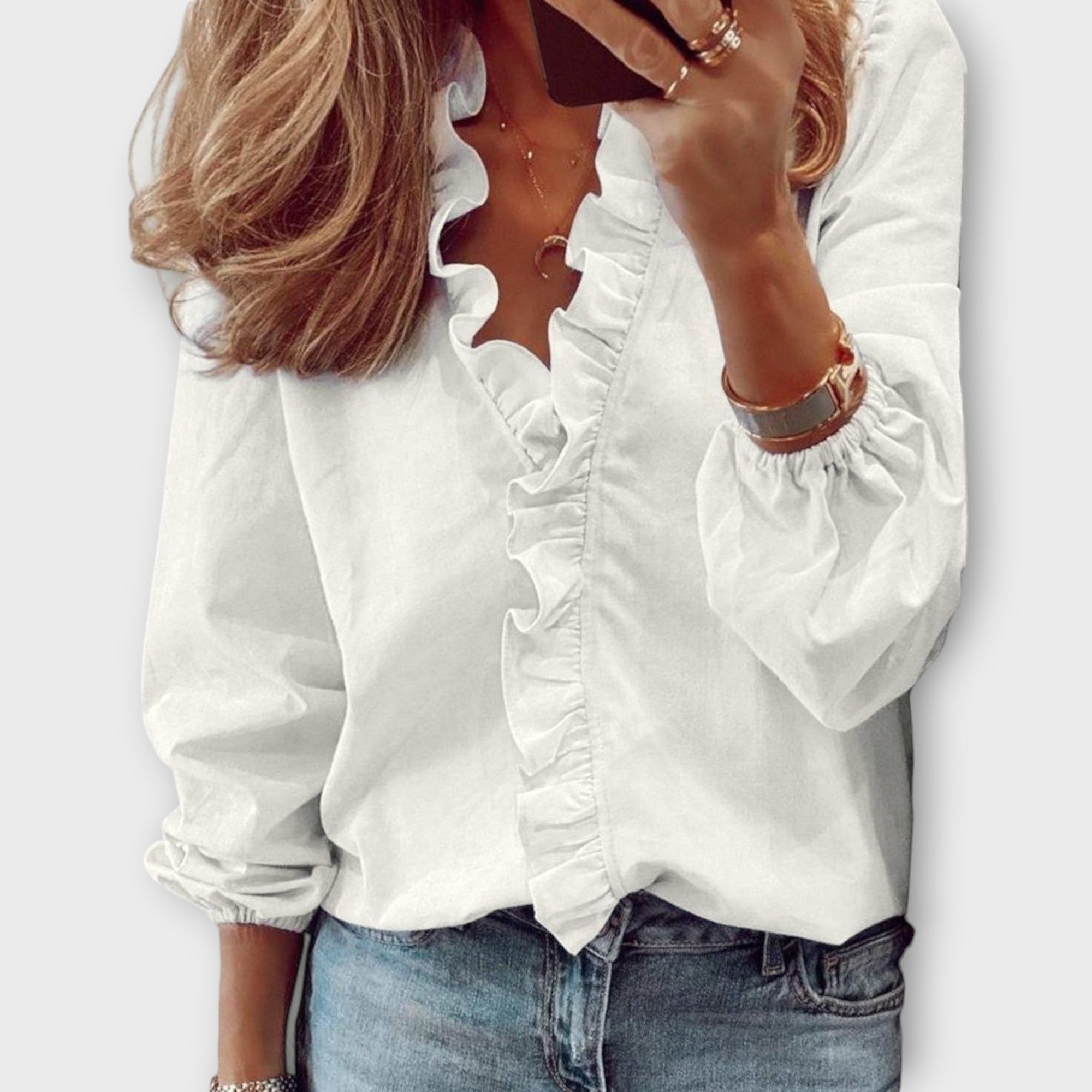 Isadora elegant summer blouse shown in soft white, light blue, mint and orange colours