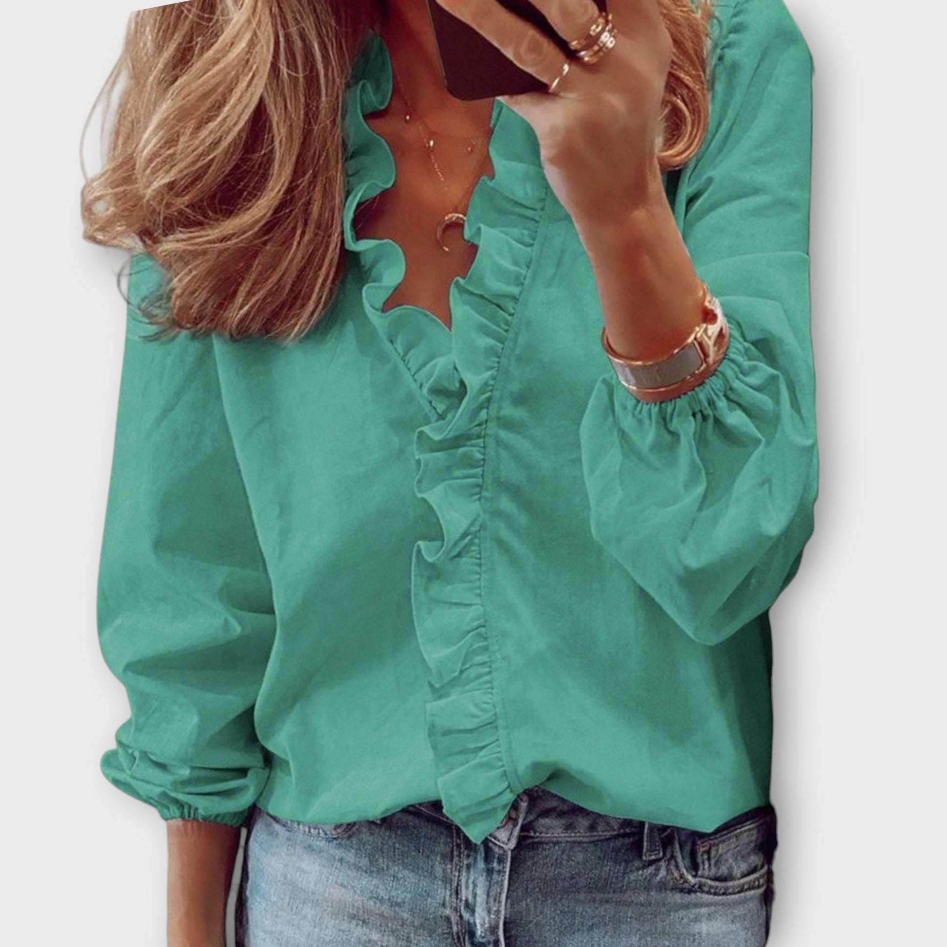 Isadora elegant summer blouse shown in soft white, light blue, mint and orange colours