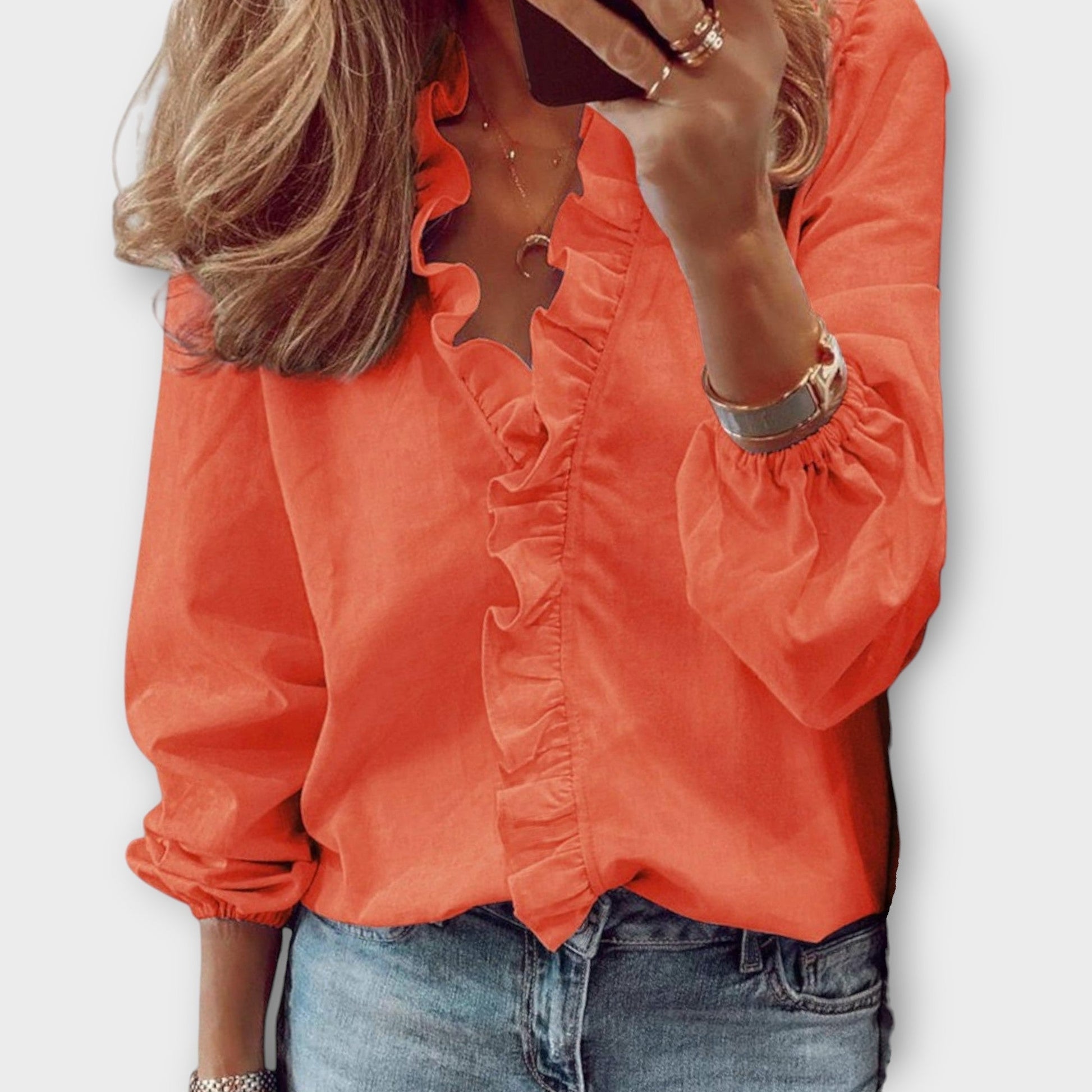Isadora elegant summer blouse shown in soft white, light blue, mint and orange colours