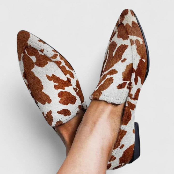 Brown classic slip-on moccasins for women with a refined, timeless silhouette
