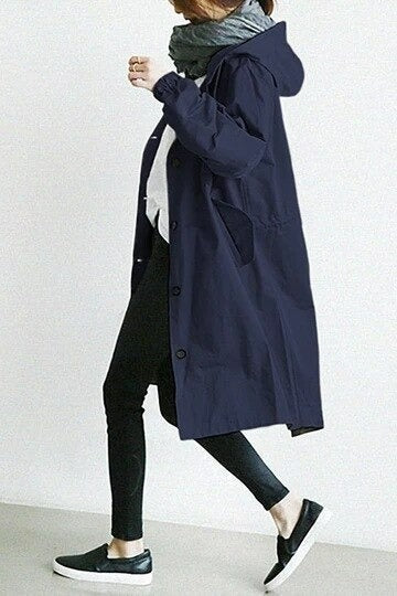 Eva tailored trench coat shown in neutral and soft colours, buttoned and belted