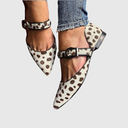 Beige studded Mary Jane flats with a classic strap and feminine silhouette