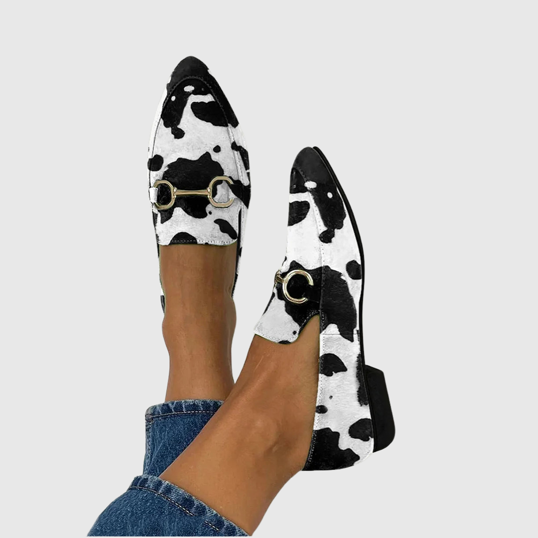 Black printed loafers with buckle detail, classic slip-on silhouette