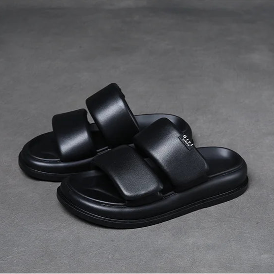 Soft leather flat sandals with 2cm heel in black and beige tones