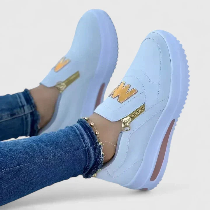 Comfortable everyday slip-on shoes shown in red, white, blue and black