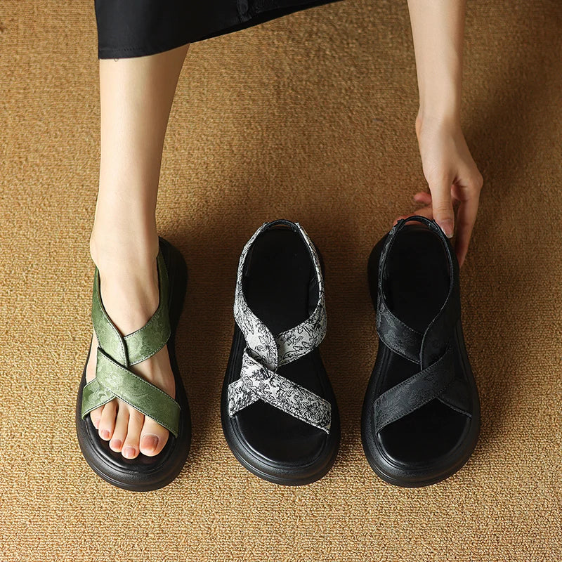 Floral embossed crisscross platform sandals with chunky sole in black