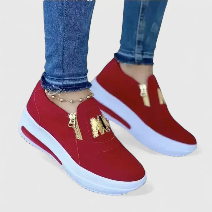 Comfortable everyday slip-on shoes shown in red, white, blue and black