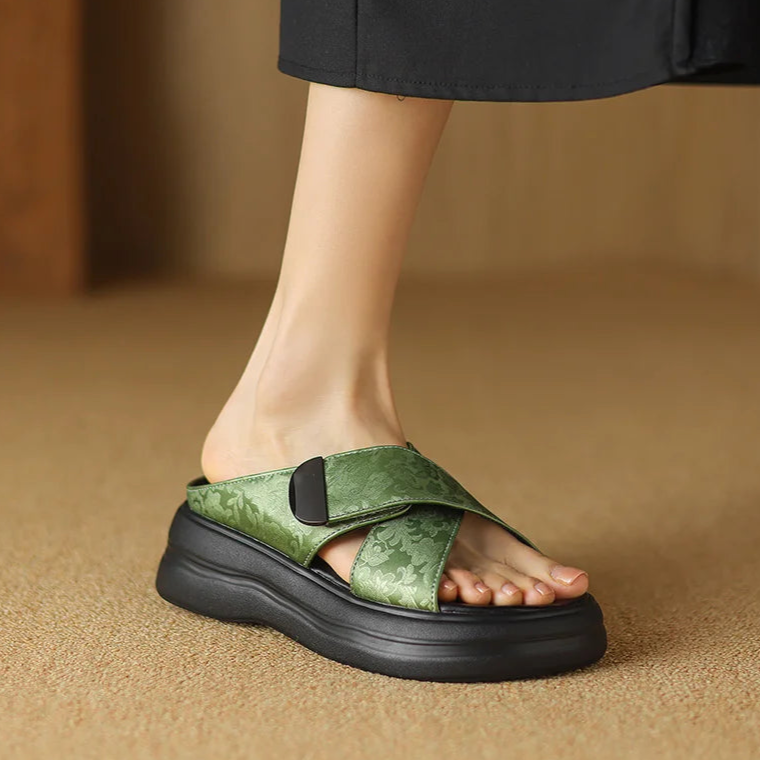 Floral textured platform sandals with wide crisscross velcro straps and elevated sole