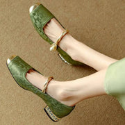 Brocade flats with gold-toned pearl strap and crystal-studded low block heel