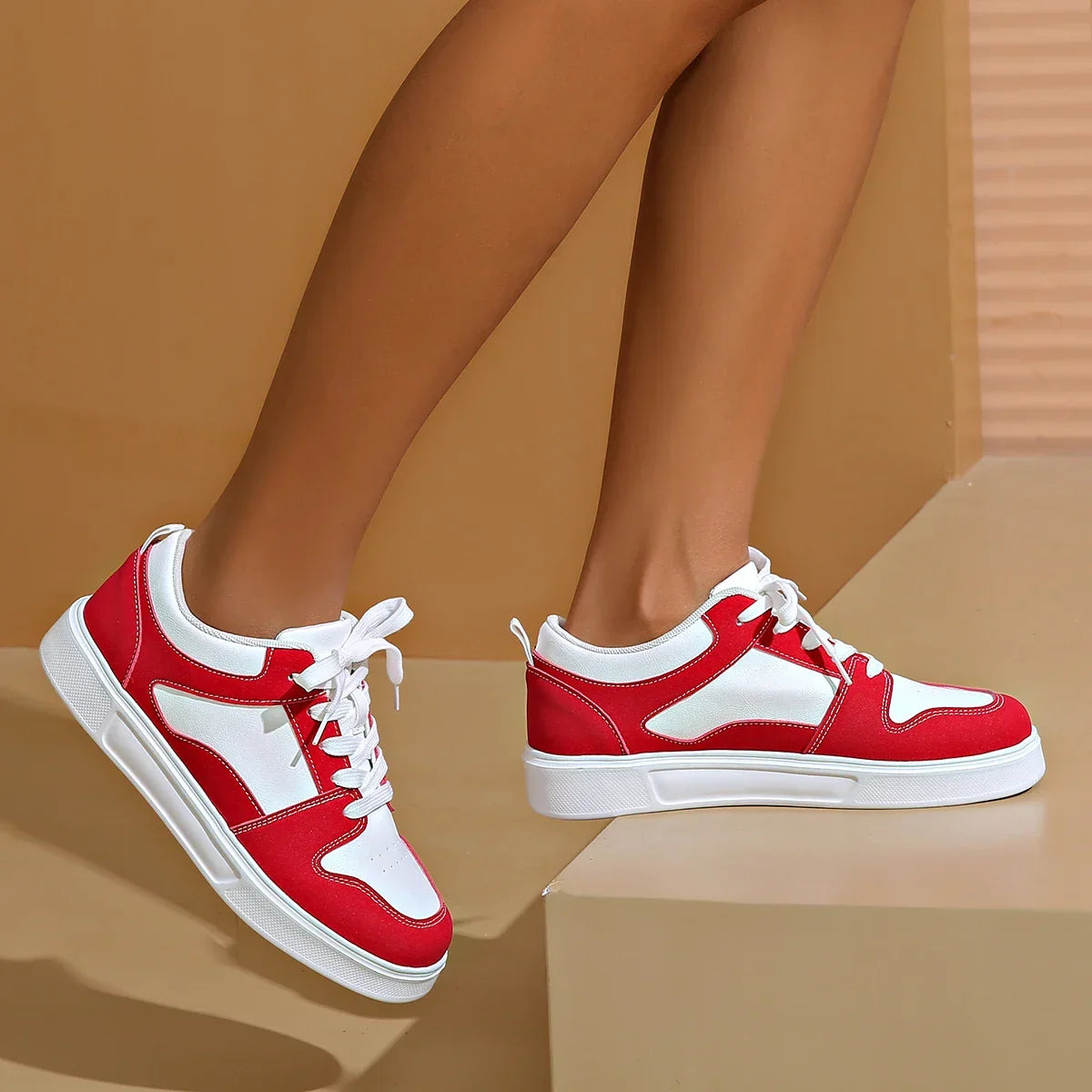 Cushioned low-top lace-up sneakers with breathable panels and treaded sole