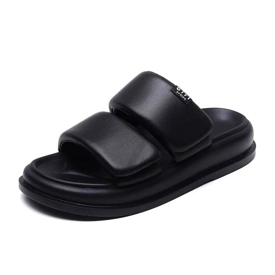 Soft leather flat sandals with 2cm heel in black and beige tones