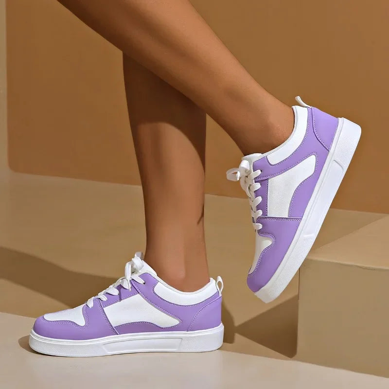 Cushioned low-top lace-up sneakers with breathable panels and treaded sole