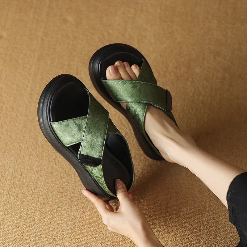 Floral textured platform sandals with wide crisscross velcro straps and elevated sole
