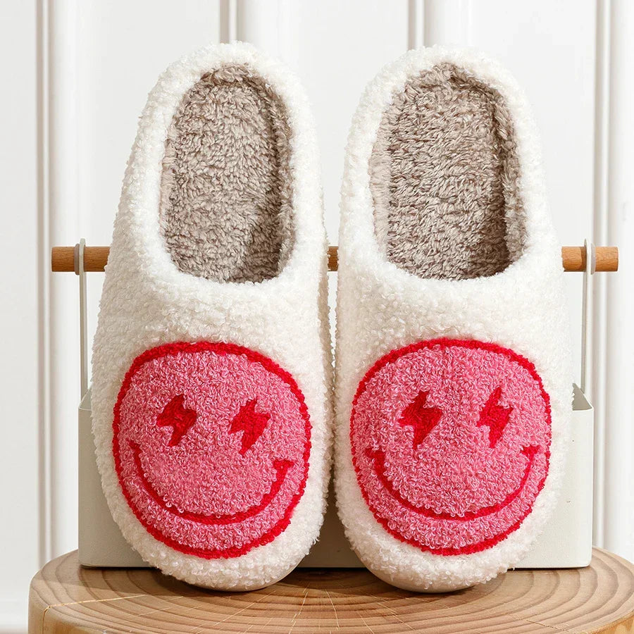 Fluffy smiley face house slippers for women in soft blue and pink