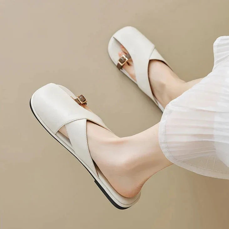 Semi-closed leather slippers with a low heel and open toe in ivory and khaki