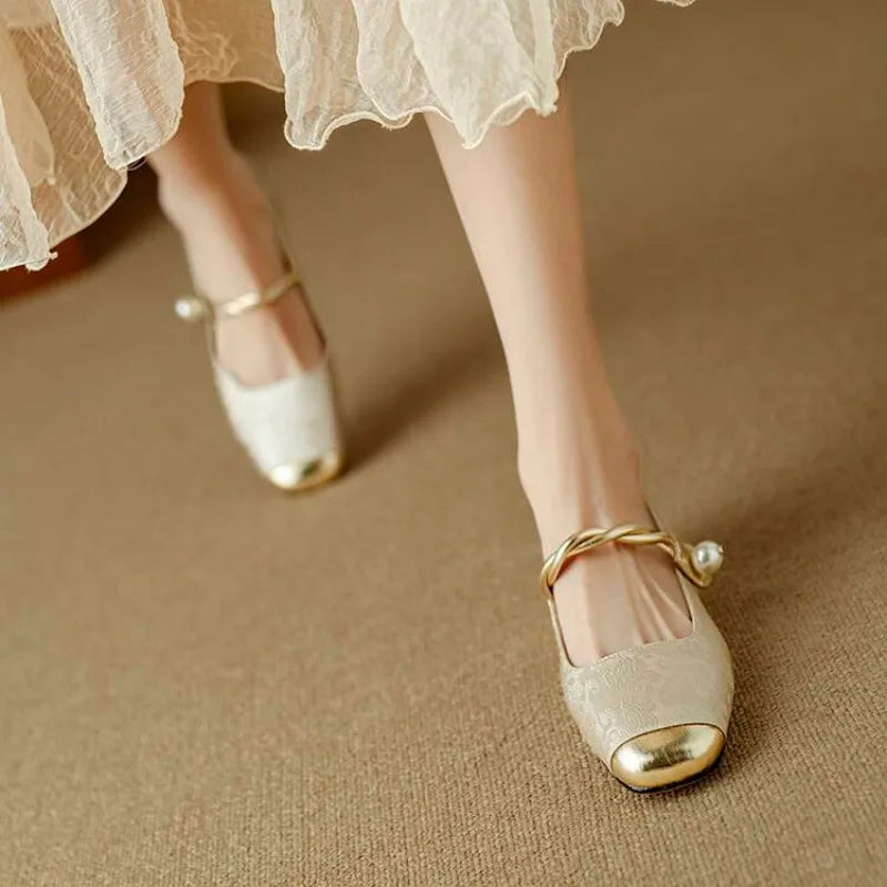 Brocade flats with gold-toned pearl strap and crystal-studded low block heel