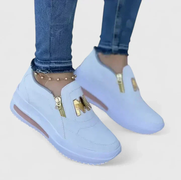 Comfortable everyday slip-on shoes shown in red, white, blue and black