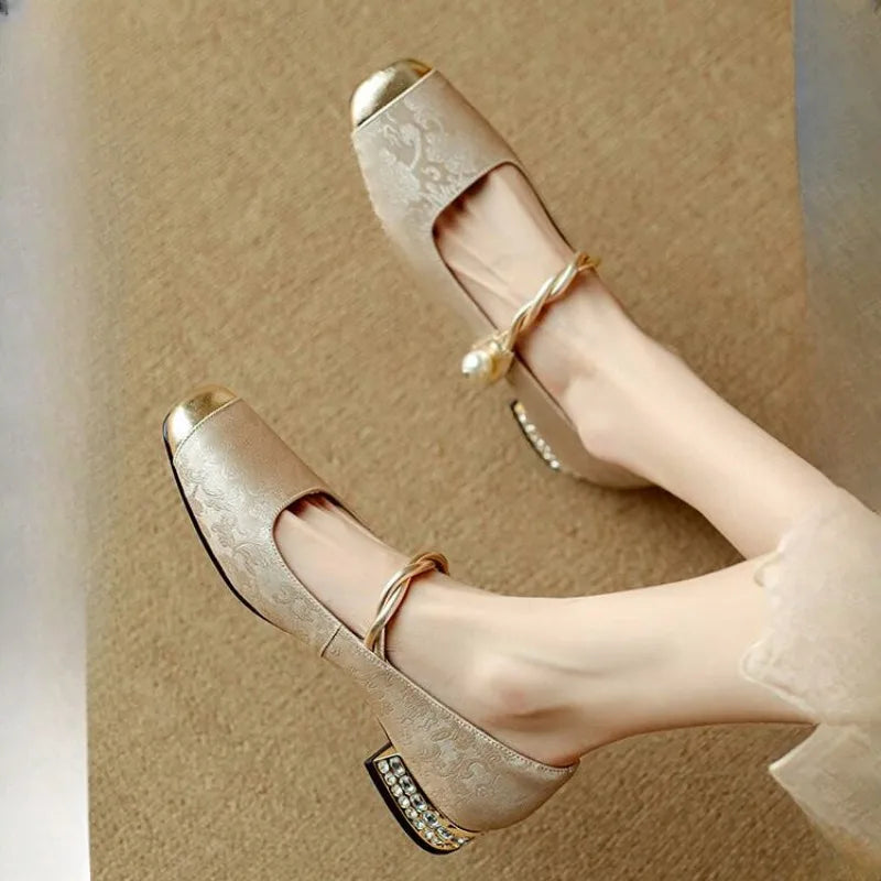 Brocade flats with gold-toned pearl strap and crystal-studded low block heel
