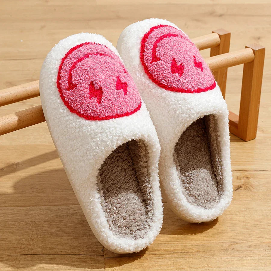 Fluffy smiley face house slippers for women in soft blue and pink
