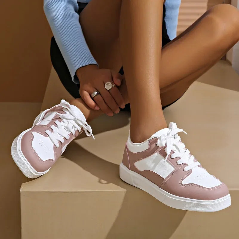 Cushioned low-top lace-up sneakers with breathable panels and treaded sole