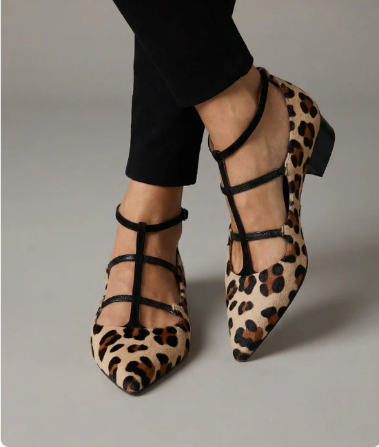 Women's heeled shoes with a leopard-print strap and classic silhouette