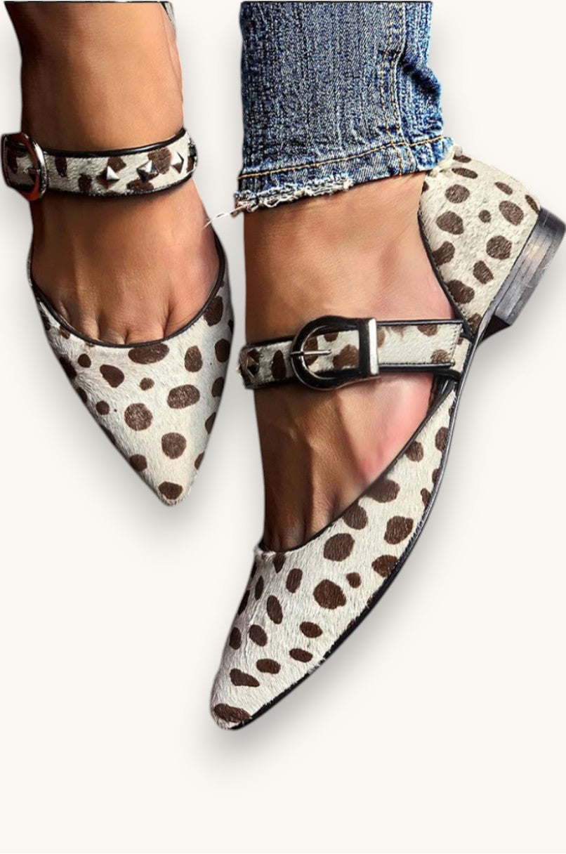 Beige studded Mary Jane flats with a classic strap and feminine silhouette
